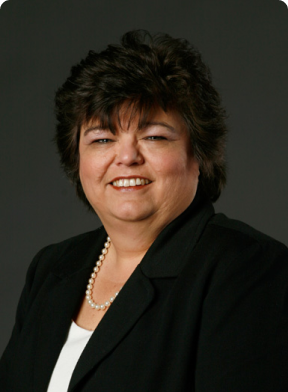 Wendy Pitts, COO of Georgia's Harbin Clinic, smiling and wearing a black suit.
