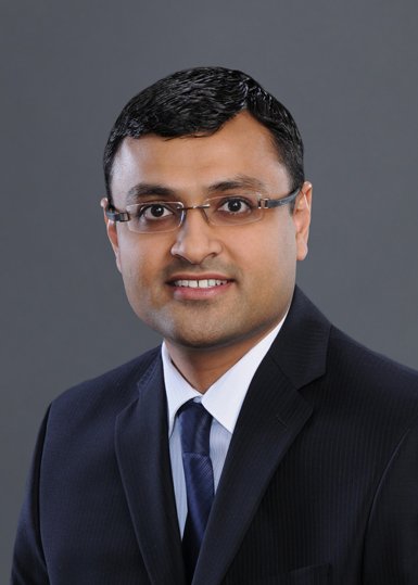 Dr. Patel, a pulmonologist, smiling